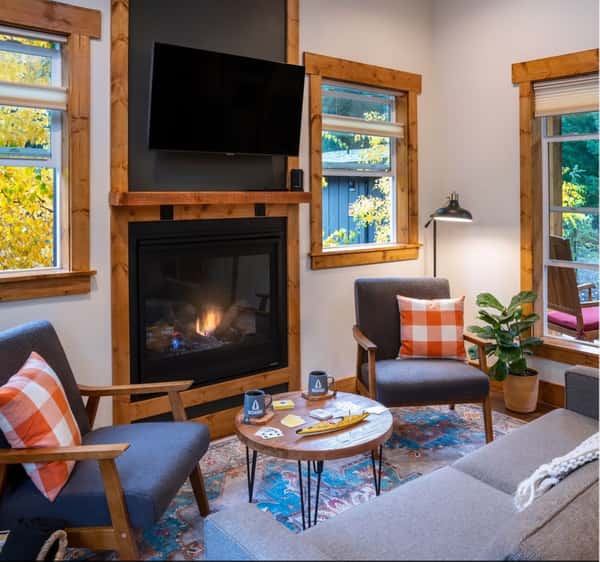 Backwoods Cabins interior with fireplace, TV and comfort.