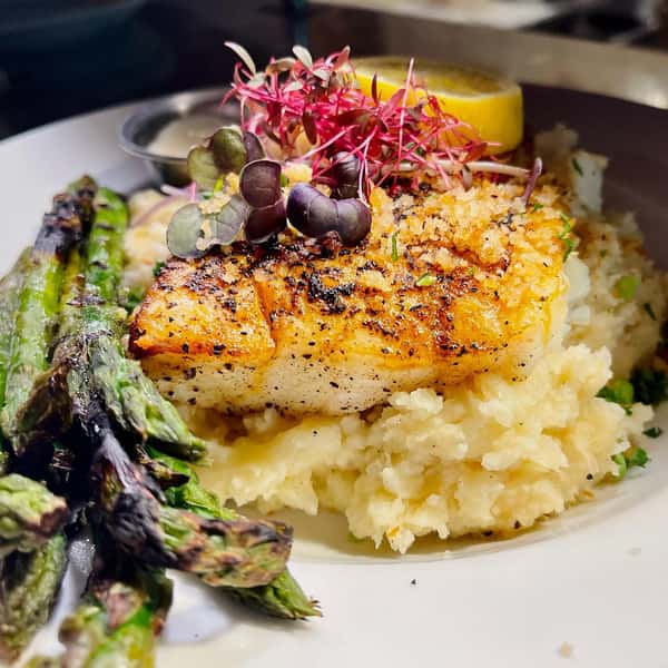 Grilled Alaskan Halibut on garlic mash and asparagus topped with a crispy lemon pepper panko crumble