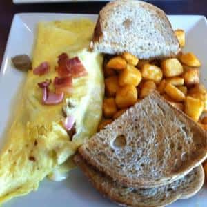 Omelette, Bacon bits, toast, and hashbrowns