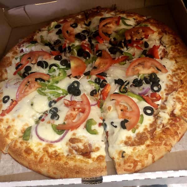 Pizza with cheese, tomatoes, onions, peppers, and olives in carboard box