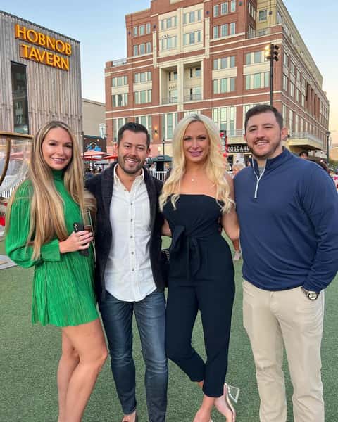 Two couples posing at an event at the Hobnob