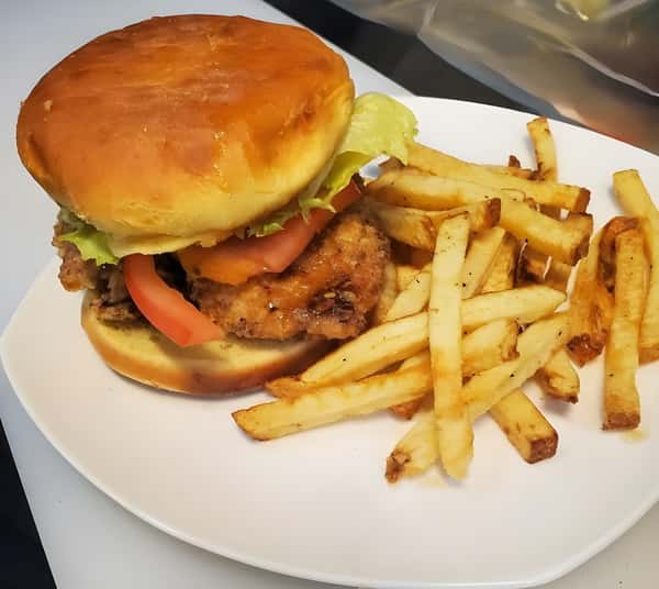 Sandwich with lettuce tomato and fried chicken