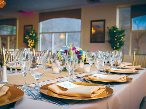 banquet table set inside a dining room
