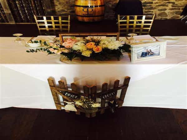 sweetheart table set with floral centerpiece