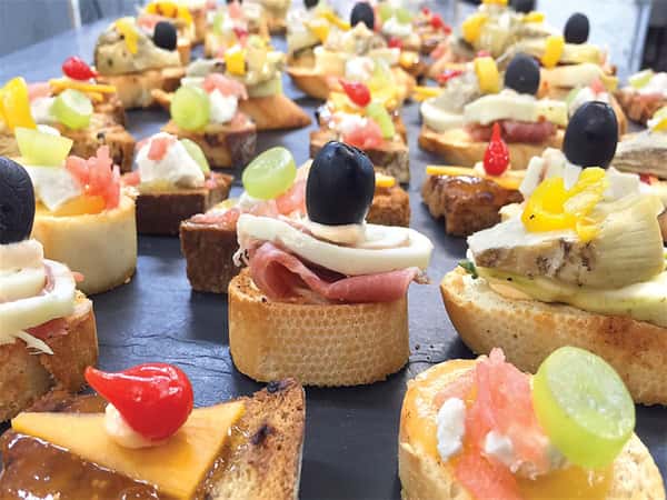bite sized appetizers on a slate tray