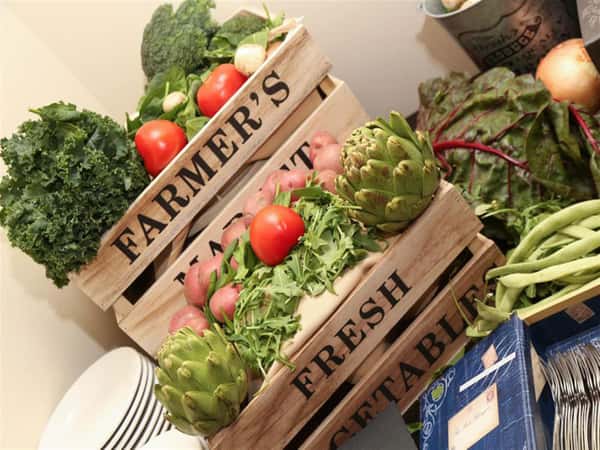 tablescape set with vegetabkes and farmer's market crates
