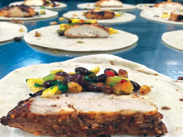 crusted pork topped with a mix of copped vegetables