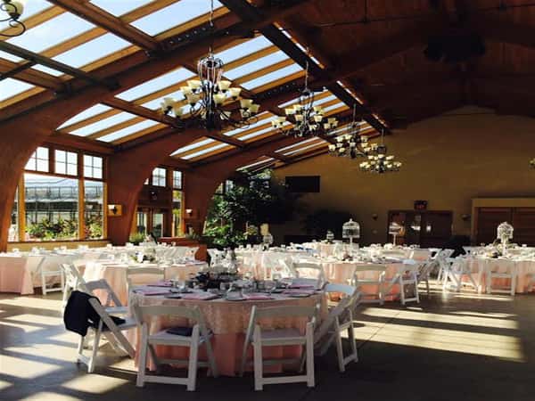 banquet tables set inside dining room with glass ceilings