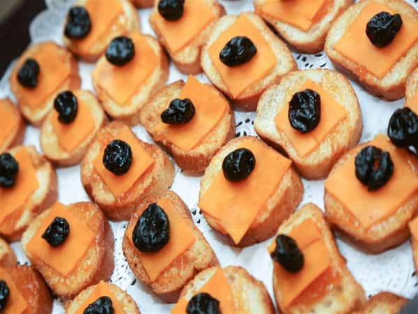 crustini topped with cheese and fruit