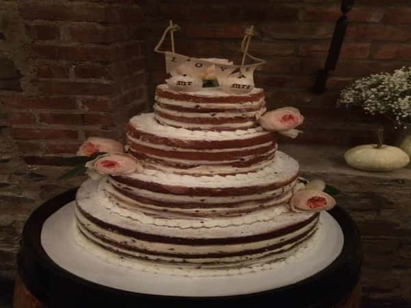 naked cake topped with peonys