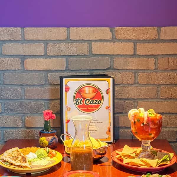 Mexican favorites at El Cazo Mexican Restaurant featuring a shrimp cocktail, quesadilla, tortilla chips with house salsa, and fresh Mexican dishes served in a warm, inviting dining atmosphere.