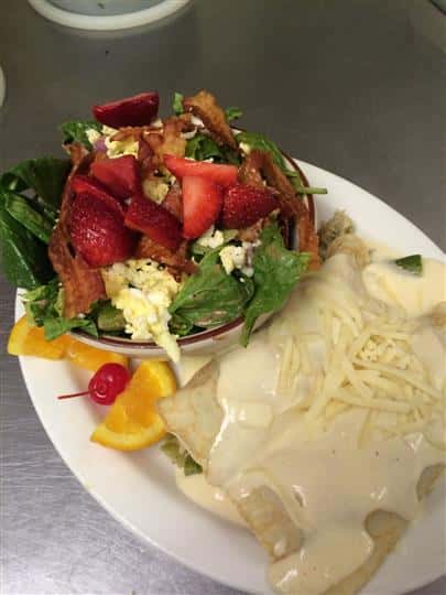 Enchiladas with Side Salad Garnished with Fruit