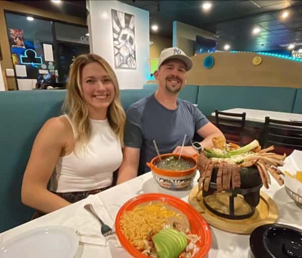 Couple sitting at a table within La Cascada