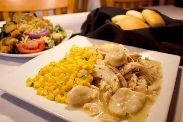 grilled chicken with a pile of corn