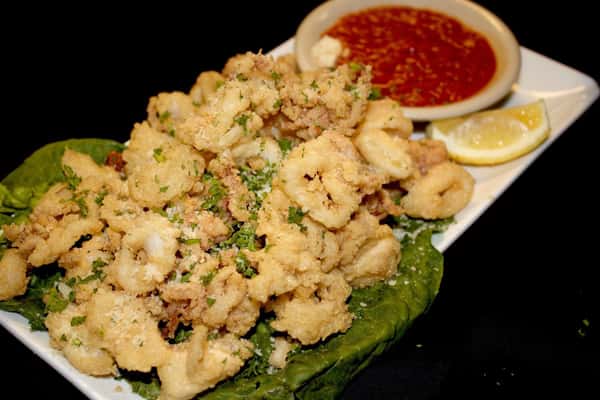 fried calamari with a side of dipping sauce