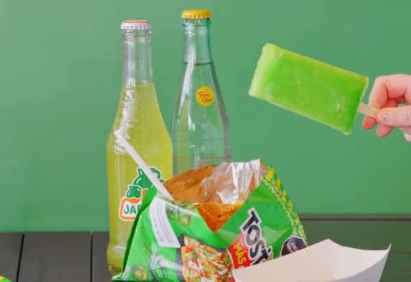 Our version. of Walking Nachos, Tostitos chips, nacho cheese our fresh street corn and cotija cheese. This is your new favorite snack, we promise! Pair it with a Jarritos bottled drink and it's the most perfect menu hack!