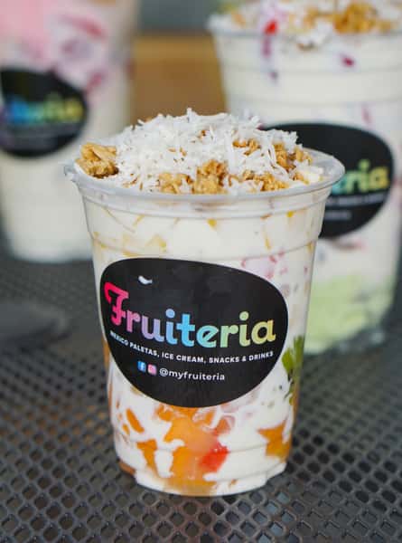 Craving something delicious but just want a small taste? Any of our treats can be made small. This is a fresh fruit cup with our sweet cream, sprinkled with granolaand shaved coconut. It's delicious, definitely a best kept secret!