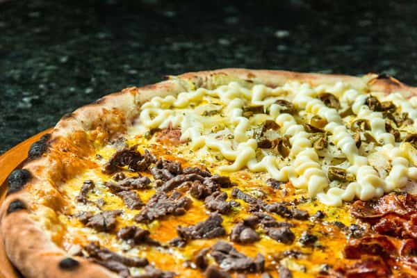 pizza with meat and cheese