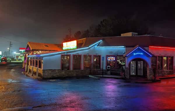 Exterior restaurant with neon lighting at night