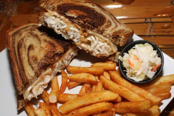 sandwich on rye with fries and coleslaw