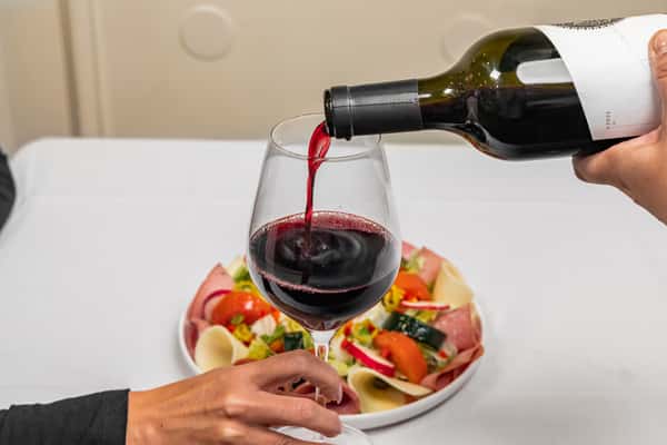 pouring wine in glass