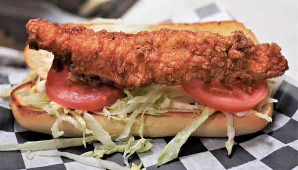 fried catfish sandwich with lettuce and tomatoes