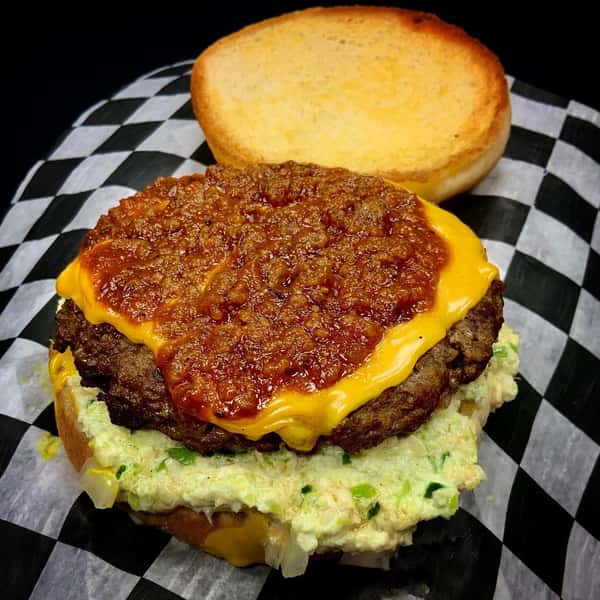 cheeseburger with lettuce topped with chili