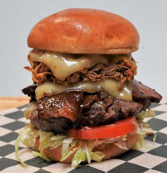 Angus beef patty, brisket and St. Louis BBQ with lettuce. tomato and three slices of pepper Jack cheese