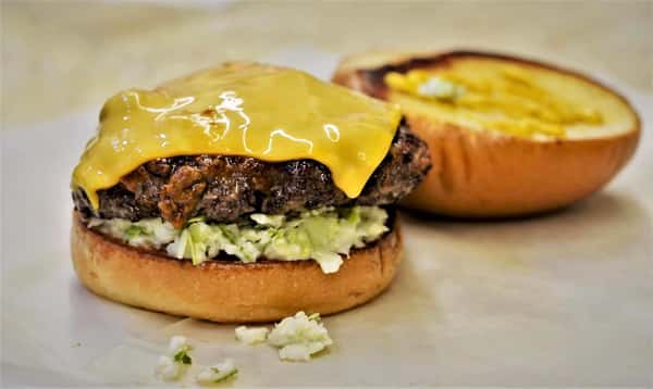 open faced cheeseburger with lettuce
