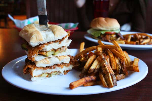 lunch plates with burgers, sandwiches, and fries