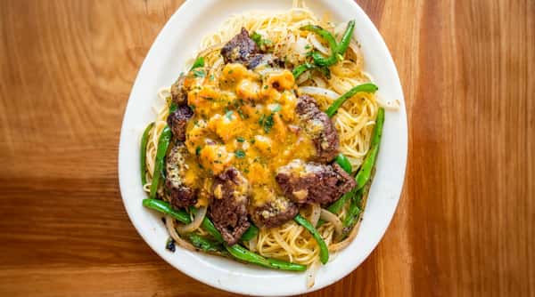 Cajun surf and turf pasta with steak and seafood at Woody's Burgers and Bugs