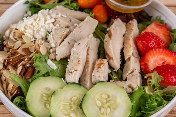 Dive into the vibrant flavors of Paul's Salad at FK Nader's! 🥗😋 This delicious plate is a beautiful medley of mixed greens, grilled chicken, fresh strawberries, and crunchy cucumbers. And that's not all - it's also sprinkled with feta cheese, juicy cherry tomatoes and sliced almonds. Topped off with our house dressing, this salad is the epitome of freshness! Come savor the burst of flavors in every bite. #PaulsSalad #FKPoBoys #FreshAndDelicious