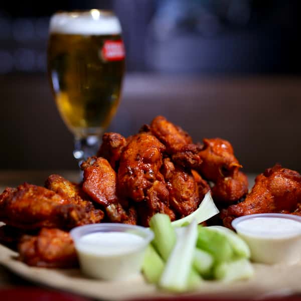 wings with celery and a beer
