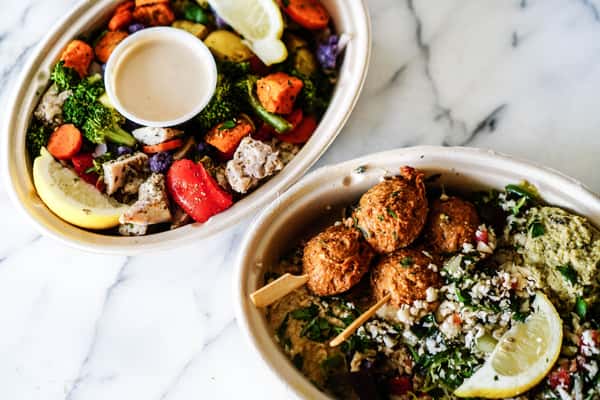 top-view-of-two-vibrant-mediterranean-bowls-featuring-fresh