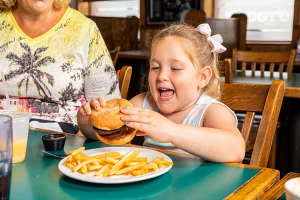 little girl with burger