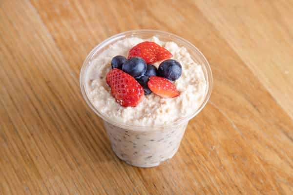 Creamy overnight oats topped with fresh berries for a nutritious grab-and-go breakfast.