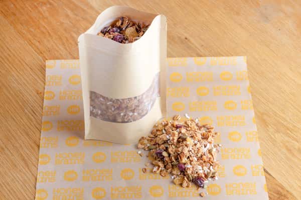 House-made granola clusters with oats, seeds, and natural ingredients for a wholesome breakfast or snack.