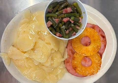 Grilled Ham Steak brings hearty comfort to the table with savory grilled ham steak, creamy scalloped potatoes, and green beans for a meal that feels satisfyingly complete 🍽️ Stop by Aunt Alice's Kitchen and dig into a classic done right. #AuntAlicesKitchen #GrilledHamSteak #ComfortFood #DinnerTime