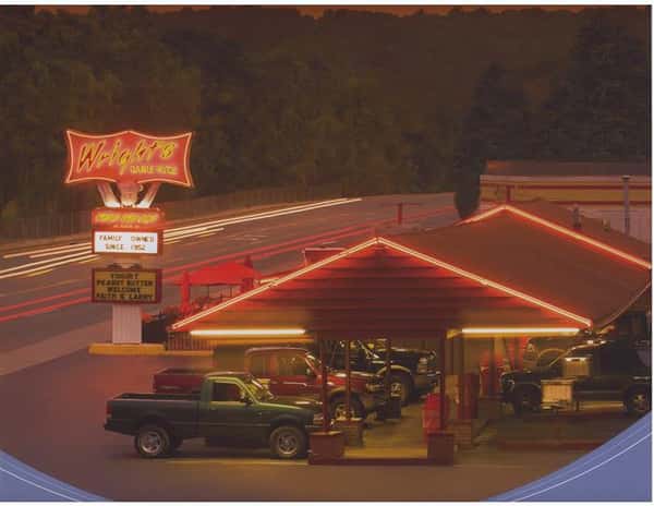Outdoor shot of the restaurant's parking by night