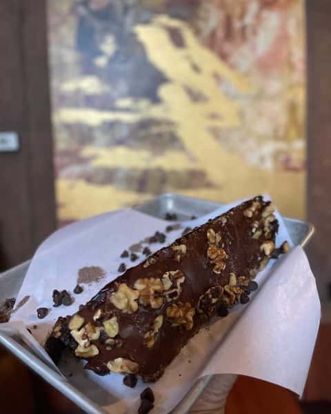 🍫 Go big or go home. The Motherlode Cake is stacked, decadent, and made to satisfy every chocolate craving. Who's sharing? 😏