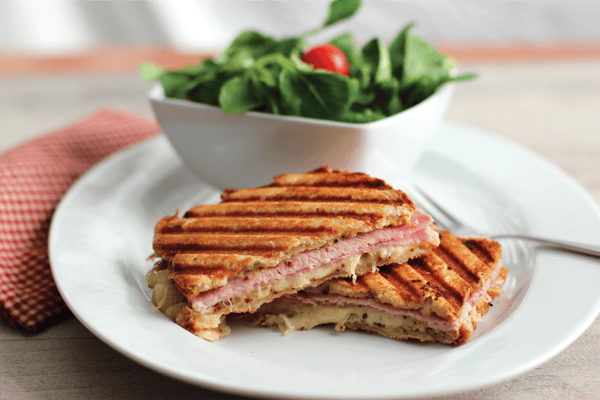 ham and cheese panini with a side salad