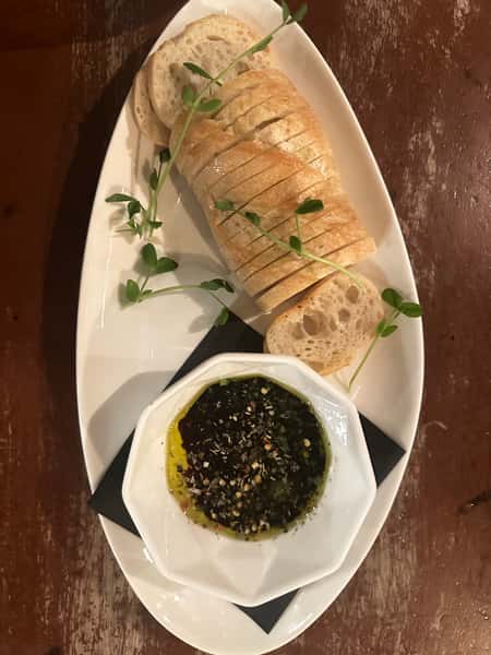 Delicious bread served with a flavorful dipping sauce