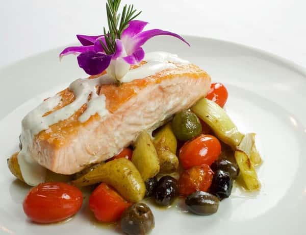 pan roasted salmon on top of vegetables-min