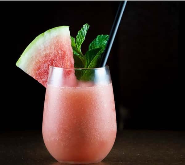 Watermelon cocktail with watermelon garnish slice