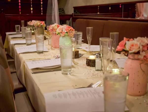 Table setting with glassware and flowers