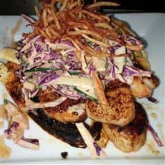 menu item with grilled red cabbage on a bun