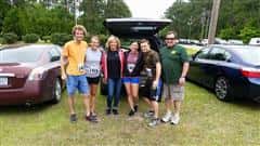 a family smiling at the beginning of the race