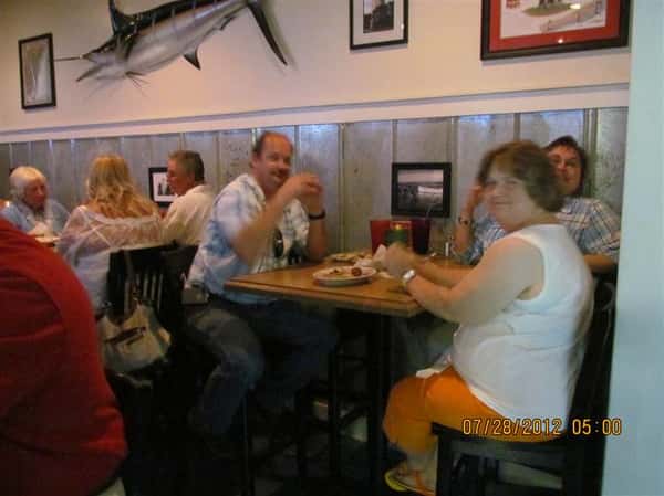 customers at their table for the 3 year anniversary party