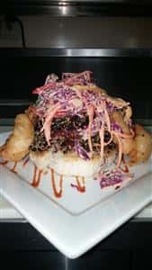 menu item with grilled red cabbage on a bun