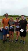 the same family covered in mud at the end of the race